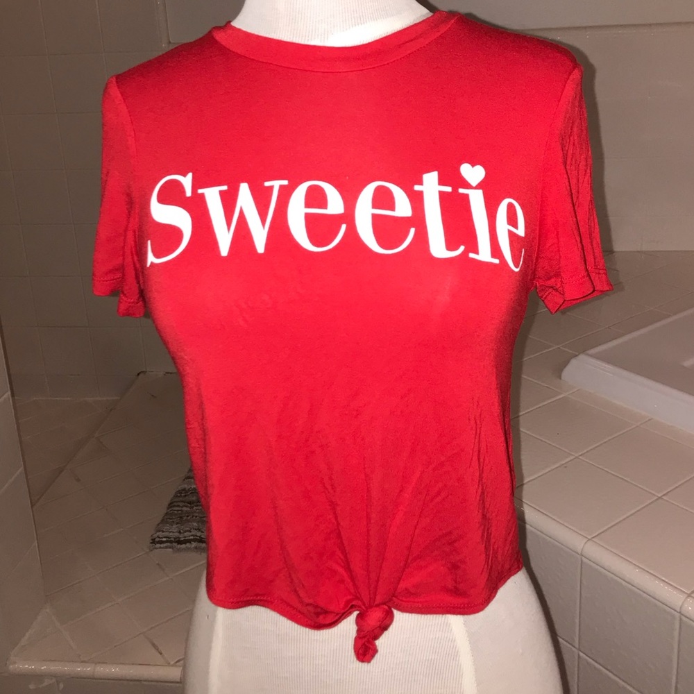 Red T-shirt with font knot that says “Sweetie”